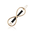 Barrette dorée signe infini avec gaine antidérapante noire sur fond blanc pur - Or (avec manchon noir)