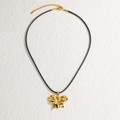 Minimalist 18K gold stainless steel bow pendant necklace with black wax cord on white surface - Black Cord Gold Bowknot Style