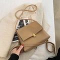 Minimalist khaki leather crossbody bag with a gold square buckle and adjustable strap - Khaki