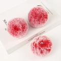 Detail of three red and white gradient faux rabbit fur pompom charms on a white book - Light Gold 4-Link Lobster Clasp / Frosty Deep Red