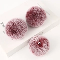 Three burgundy faux fur pom poms with elastic loops on a minimalist white background - Light Gold 4-Link Lobster Clasp / Frosty Jujube Red