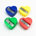 Manual heart-shaped pencil sharpeners in blue, yellow, green and red colors - Heart Shaped
