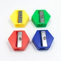 Pack of four colorful hexagonal mini pencil sharpeners in yellow green red and blue - Hexagonal