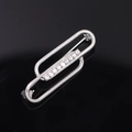 Silver safety pin brooch with sparkling crystals on a black reflective background - Interlocking Oval Style (YNCP04805) / Silver