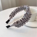 Detail showing the pleated gray fabric texture and black ends of the stylish headband - Light Gray