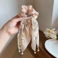 Silk bow hair scrunchie with floral print and pearl pendant detail in champagne color - Beige Ribbon