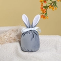 Detailed view of gray velvet rabbit ear gift bag with silk ribbon on knit fabric - Large / Haze Blue