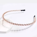 Close-up of pink beaded crystal headband with metallic woven details and anti-slip tips - Pink