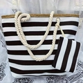 Detail of black and white striped canvas beach tote bag with beige rope handles - Black