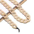 Macro shot of cream acrylic chunky eyewear chain with black rubber connector loops - 18 Cream