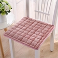 Plush pink flannel chair cushion with square texture on white chair in home setting - Pink