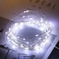 Copper wire warm white fairy lights strings coiled on a book for ambient decoration - 1 Piece / 2M White Light