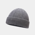 Detail shot of charcoal grey knitted beanie featuring classic ribbed texture and folded cuff - One Size / Gray