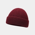 Macro detail of the wine red knitted beanie showing soft ribbed texture and folded cuff - One Size / Dark Red