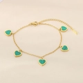 Detailed close-up of 18K gold plated bracelet with five green striped heart charms - Green