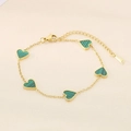 Macro detail of 18K gold plated chain featuring five green malachite heart charms - Green (Malachite Pattern)