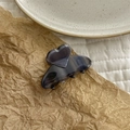 Close-up of translucent heart acetate hair clip with retro purple smoky finish - Blue Grey Stripe
