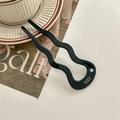 Macro shot of a black wave U-shaped acetate hair pin with crystal and France handmade text - Black