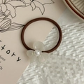 Detail view of French vintage hair tie with white jasmine flower and pearl accent - Pearl White