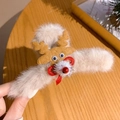 Detail of plush Christmas reindeer hair claw clip with red nose and bow decoration - Brown Elk