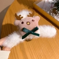 Detail of plush Christmas reindeer hair claw with pink elk antlers and green bow - Chubby Elk
