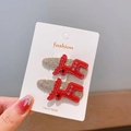 Barrettes de Noël pour enfants avec renne en feutre rouge sur socle doré pailleté - Renne