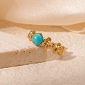 Detailed close-up of a vintage 18K gold-plated titanium ring with a turquoise gemstone - Turquoise Color Style (R0811)