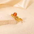 Detail of golden snake ring with orange cat eye stone and textured scale patterns - Orange Cat Eye Snake Style (R0734)