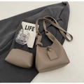 Detail of lychee pattern leather shoulder bag and pouch in taupe finish with life magazine - Gray