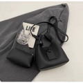 Detail of black lychee grain leather bucket bag set with matching inner pouch - Black