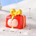 Miniature resin red gift box ornament with a fun cartoon butt design for snow globe decor - No.11 Red Yellow Gift Box with Pig Bottom