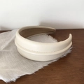 Detail of beige leather headband with elegant stitching and soft velvet lining - Off-white