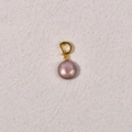 Detail view of a purple freshwater pearl pendant with a polished gold clasp - Approx 13mm Purple Button Pearl + Gold Universal Buckle