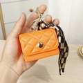 Mini orange quilted leather purse with gold hook and checkered ribbon accessory - Orange