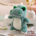 Bambola di peluche tirannosauro in morbido tessuto verde con pancia bianca sul tavolo - 25-28cm / Verde Mare