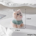 Detail of flocked resin dachshund pendant in green sweater with size and weight info - Westie in Green Clothes