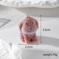 Detailed view of flocked resin dog charm with size 3.5cm x 2.2cm and 10g weight display - Golden Dog in Red Clothes