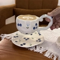 Close-up of ceramic coffee cup with hand-painted blueberry pattern and wavy handle - Korean Style Floral Blueberry Cup & Saucer Set / Cup + Saucer Set