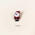 Detailed view of a Santa Claus enamel brooch with 1.6cm x 3.2cm size dimensions - Standing Santa Claus