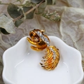 Close-up of golden squirrel brooch with orange enamel and sparkling rhinestones - DY07-Squirrel