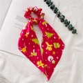 Red Christmas scrunchie with ribbons featuring gingerbread man and reindeer pattern - Red Christmas Tree Ribbon