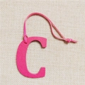 Detail of rose red letter C leather charm with litchi texture and matching lanyard - Letter C Rose Red