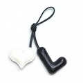 Handmade leather heart and letter L bag charm with stitched edges on black cord - Black L with Off-white Heart