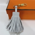 Handcrafted white sheepskin leather tassel keychain with gold-plated metal ring - White