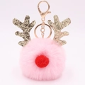 Close-up of pink fluffy pompom keychain with festive gold glitter antlers and red nose - Light Pink