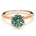 Macro shot of S925 silver ring with 6-prong moissanite in rose gold plating - US 5 / Teal