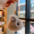 Light brownish grey plush rabbit keychain with fluffy fur and gold metal clasp - Gray Strap Style
