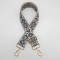Close-up of black and grey jacquard bag strap with adjustable golden metal hardware - Beige Grey Black Gold Hook