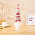 Close-up of knitted gnome wine bottle topper with red heart pattern and plush beard - Red and Grey Heart Style