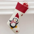Weihnachtssocke mit Pinguin-Motiv auf beige Stoff und roter Manschette als Deko - Weihnachtspinguin-Strumpf